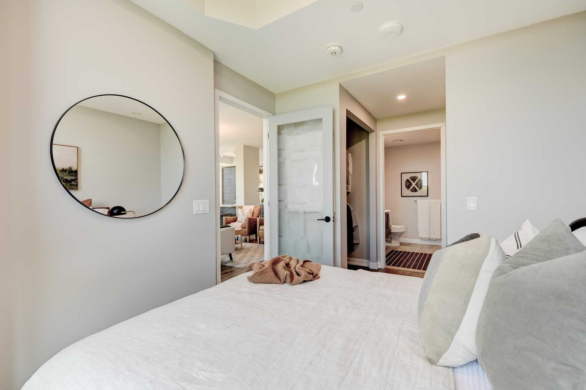 Primary bedroom with walk-through closet and four-piece ensuite beyond