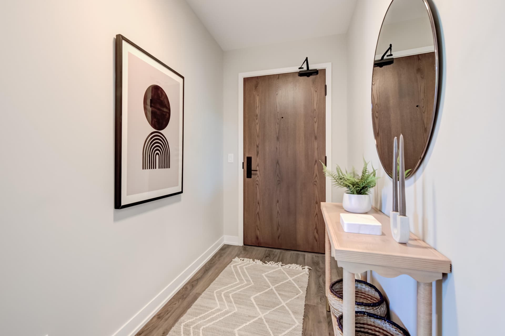 Foyer with solid wood suite entry door